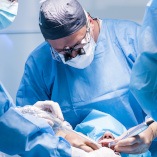 Dentists performing a dental implant surgery