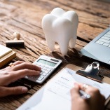 A patient calculating their dental insurance benefits